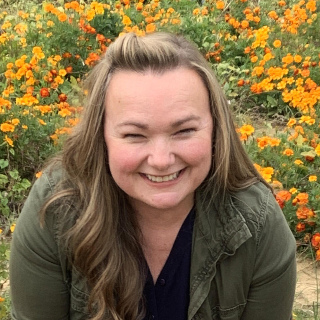 woman smiling in jean jacket